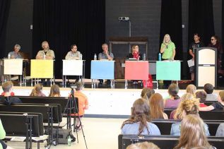 The candidates debate at GREC, from left: Independent John McEwen, Libertarian Steve Gebhardt, New Democrat Ramsey Hart, PC Randy Hillier, Liberal Amanda Pulker-Mok, Green Party Anita Payne and moderators Tyee Davis and Carrie-Lyn Shields. Photo/Craig Bakay